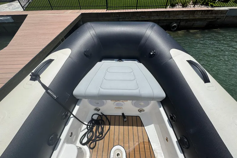 Slide: The Image of 2025 Williams Jet Tenders Sportjet 345, docked, showcasing seating and deck details. - 8
