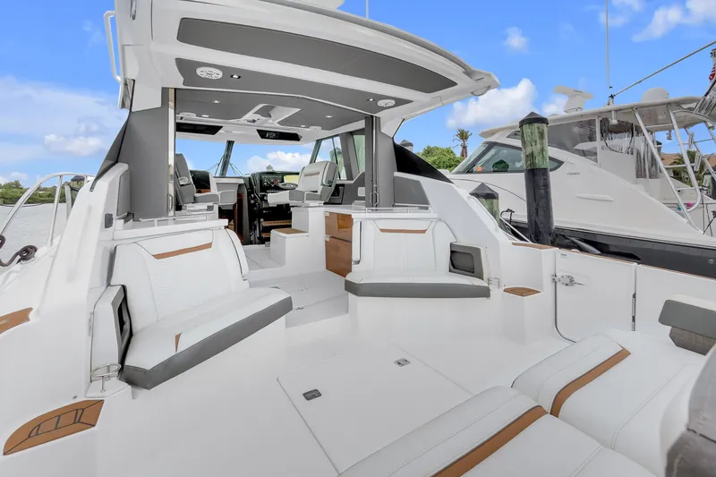 Slide: The Image of 2021 Tiara Sport 43 LE luxury boat interior with sleek seating and modern design. - 16