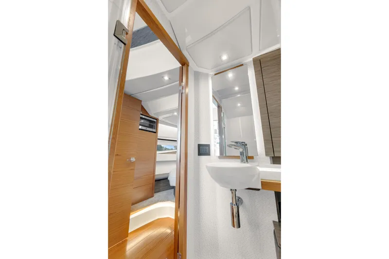 Slide: The Image of Interior of 2021 Tiara Sport 43 LE yacht, featuring modern bathroom and cabin design. - 36