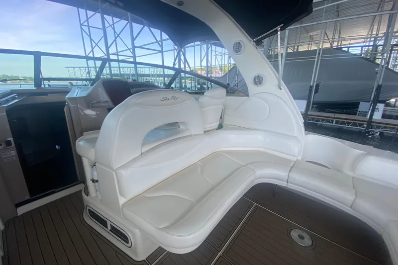 Slide: The Image of 2004 Sea Ray 380 Sundancer interior with white seating and modern design. - 17