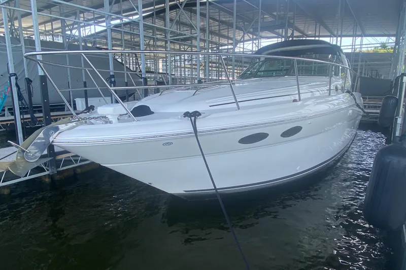 Slide: The Image of 2004 Sea Ray 380 Sundancer yacht docked in a marina. - 20