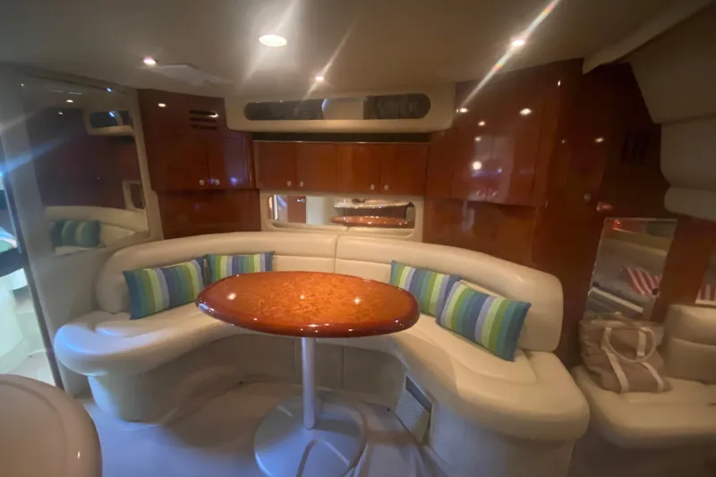 Slide: The Image of Luxurious interior of 2004 Sea Ray 380 Sundancer yacht with elegant seating and table. - 28