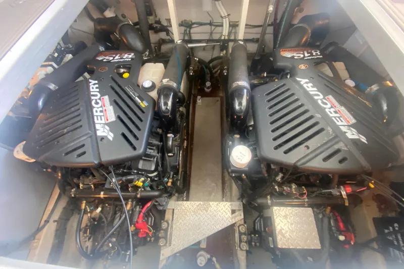Slide: The Image of Twin Mercury engines in a 2004 Sea Ray 380 Sundancer boat engine room. - 33