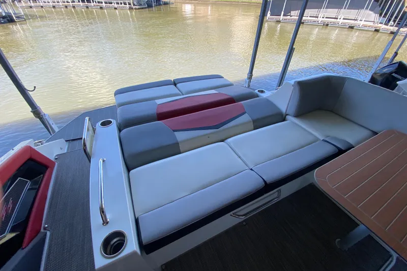 Slide: The Image of Luxurious seating on 2014 Cruisers 328 Black Diamond boat, docked by the water. - 15