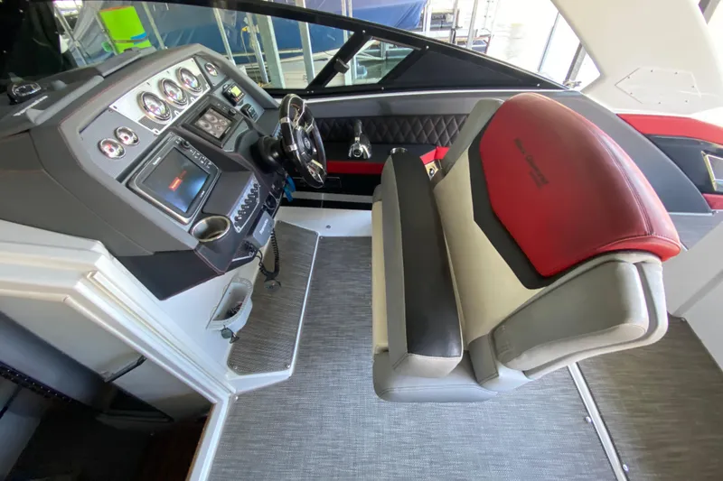 Slide: The Image of Helm of 2014 Cruisers 328 Black Diamond boat with modern controls and seating. - 20