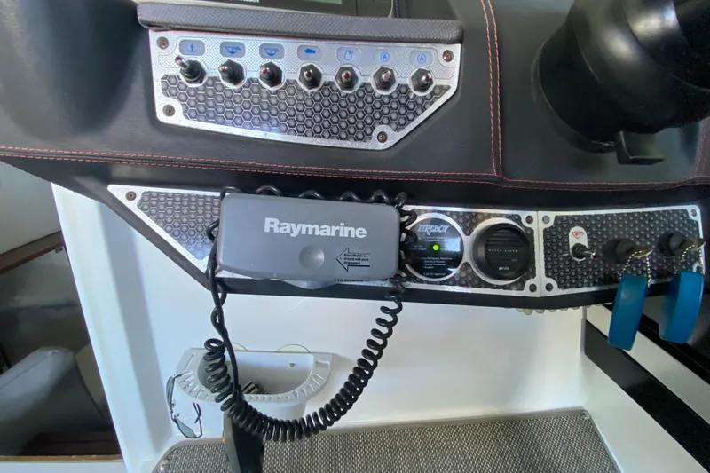 Slide: The Image of Control panel of a 2014 Cruisers 328 Black Diamond boat with Raymarine equipment. - 24