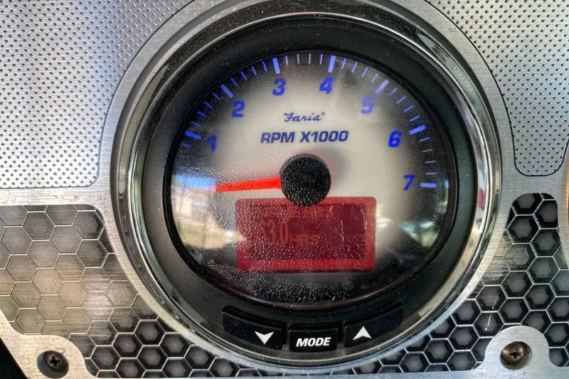 Slide: The Image of Close-up of 2014 Cruisers 328 Black Diamond RPM gauge, displaying engine hours. - 25