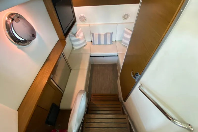 Slide: The Image of Interior of 2014 Cruisers 328 Black Diamond yacht with cozy seating and modern decor. - 30