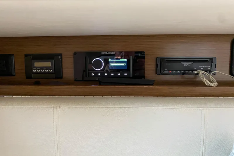 Slide: The Image of 2014 Cruisers 328 Black Diamond audio system with control panel and display. - 35