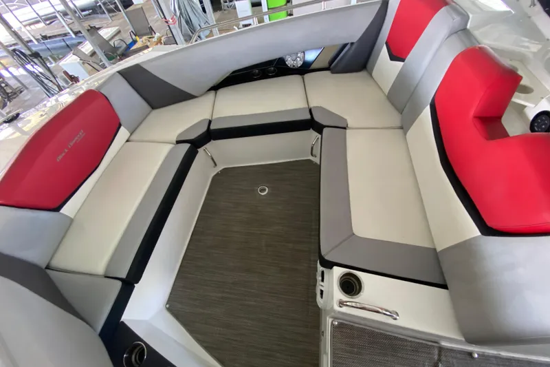 Slide: The Image of 2014 Cruisers 328 Black Diamond boat interior with red and gray seating. - 41