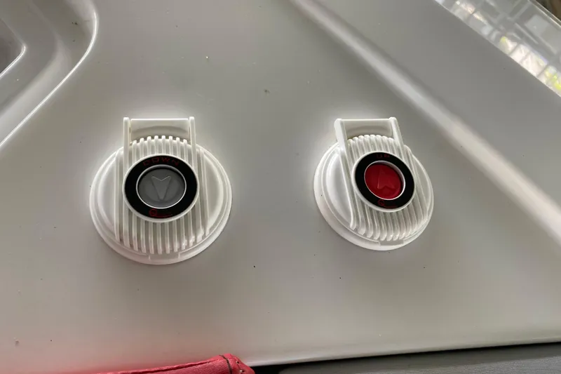 Slide: The Image of White control dials on a 2014 Cruisers 328 Black Diamond boat dashboard. - 45