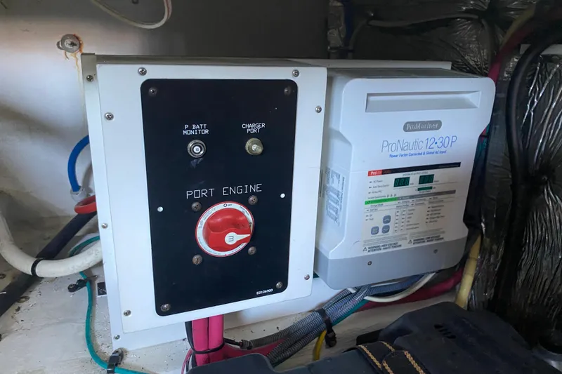 Slide: The Image of Electrical panel and ProNautic charger in 2014 Cruisers 328 Black Diamond boat engine room. - 49