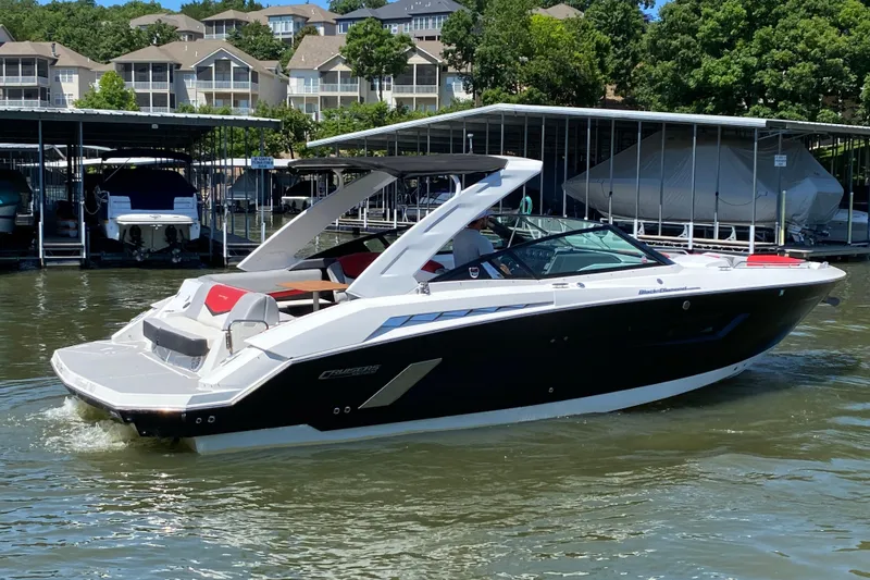 Slide: The Image of 2014 Cruisers Sport Series 328 Black Diamond boat docked on a sunny day. - 5