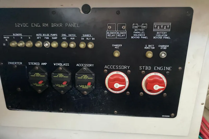 Slide: The Image of Control panel of 2014 Cruisers 328 Black Diamond boat with switches and dials. - 50