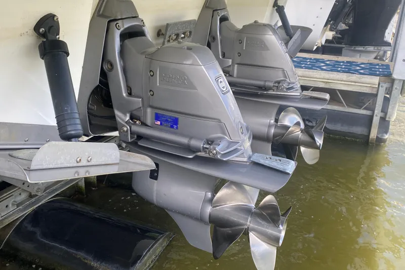 Slide: The Image of 2014 Cruisers 328 Black Diamond boat with Volvo Penta outboard engines in water. - 51