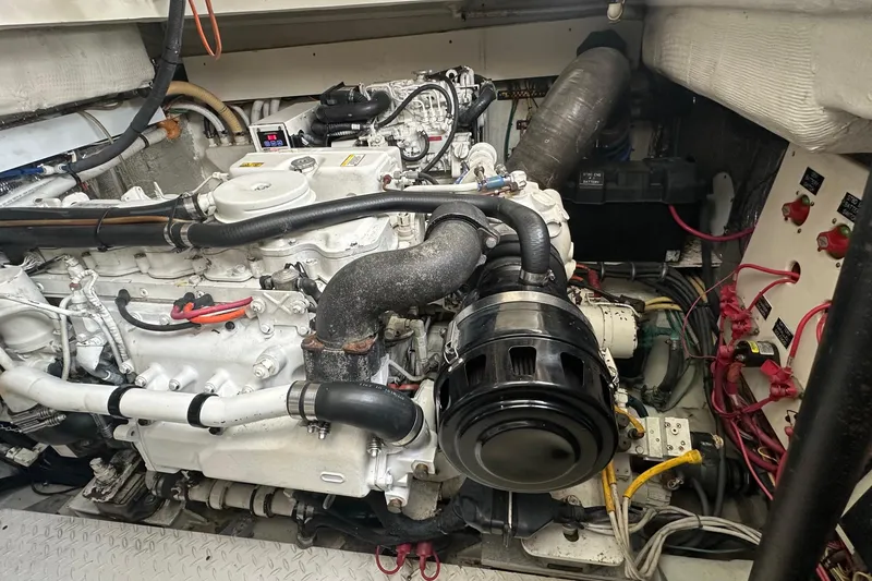 Slide: The Image of Engine compartment of a 2006 Rampage 33 Express boat, showcasing detailed mechanical components. - 17