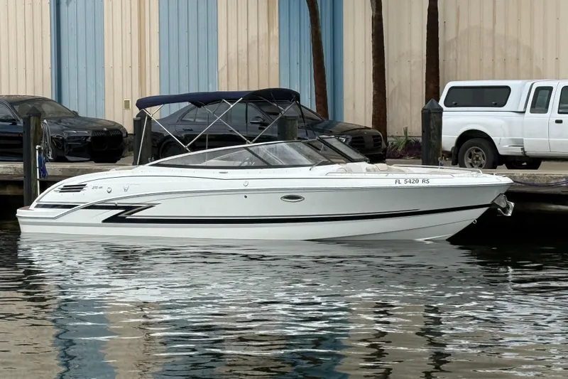 The Image of 2019 Formula 270 Bowrider boat docked at marina, featuring sleek design and white exterior. - 0