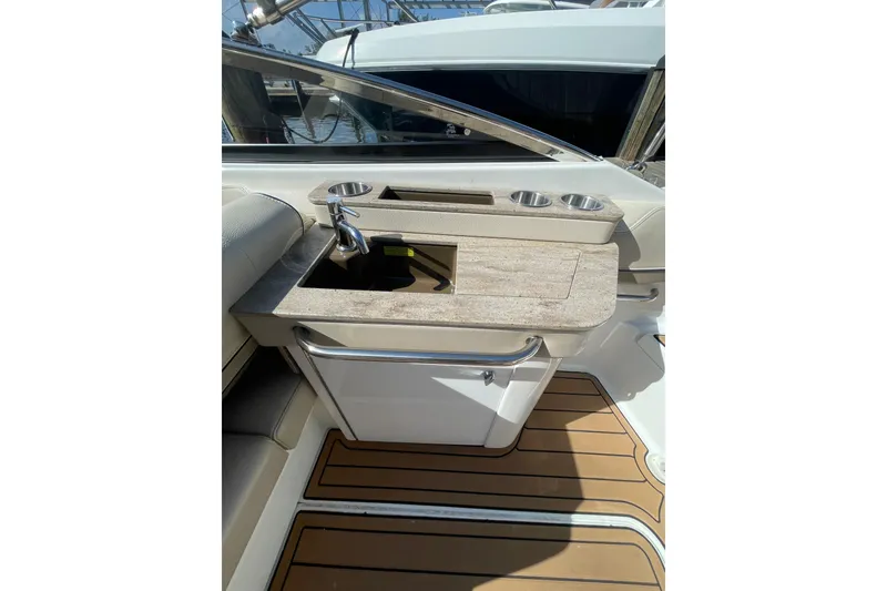 Slide: The Image of 2019 Formula 270 Bowrider boat interior with sink and cup holders. - 4