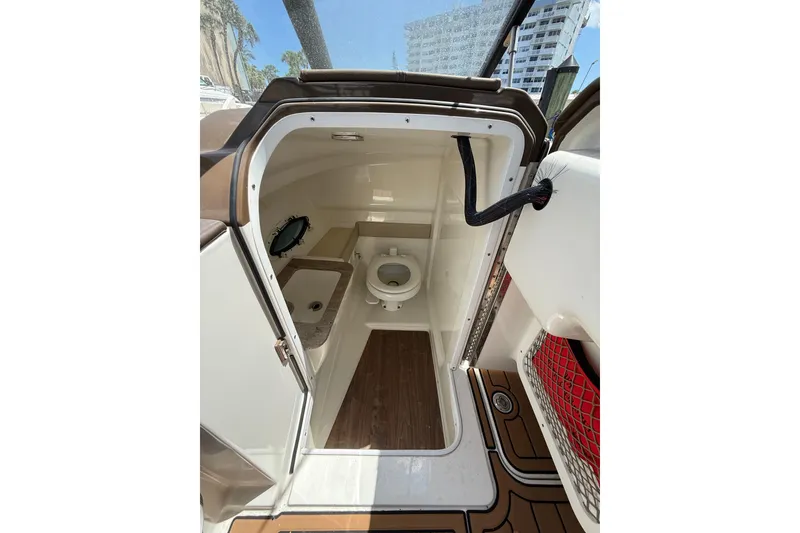 Slide: The Image of 2019 Formula 270 Bowrider boat interior with compact bathroom and toilet. - 5