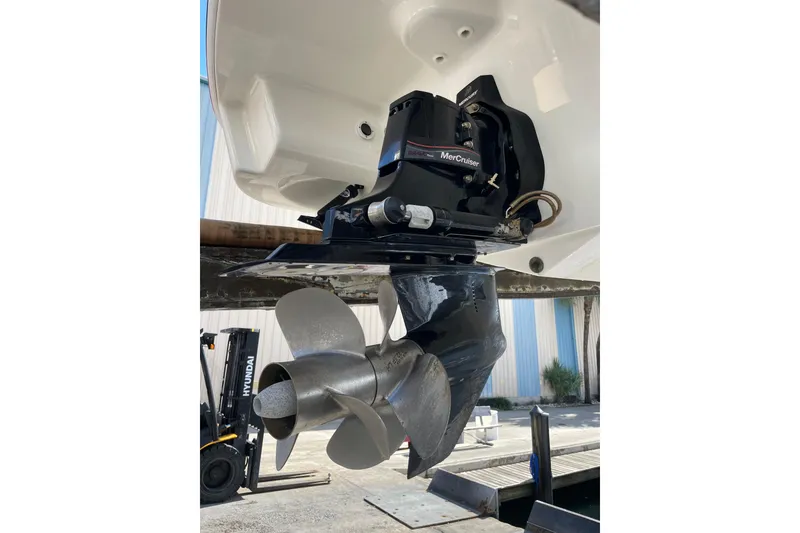 Slide: The Image of 2019 Formula 270 Bowrider boat with MerCruiser outdrive and propeller in a marina setting. - 9