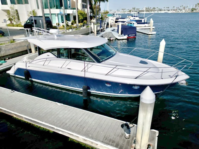 Slide: The Image of 2019 Tiara Yachts Coupe 39 at dock, modern design. - 1