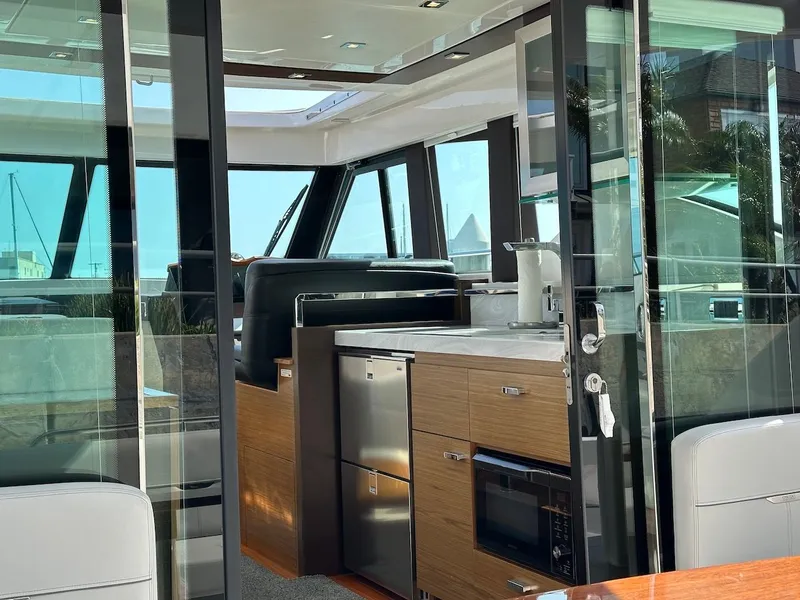 Slide: The Image of Interior of 2019 Tiara Yachts Coupe 39 featuring modern kitchen. - 11