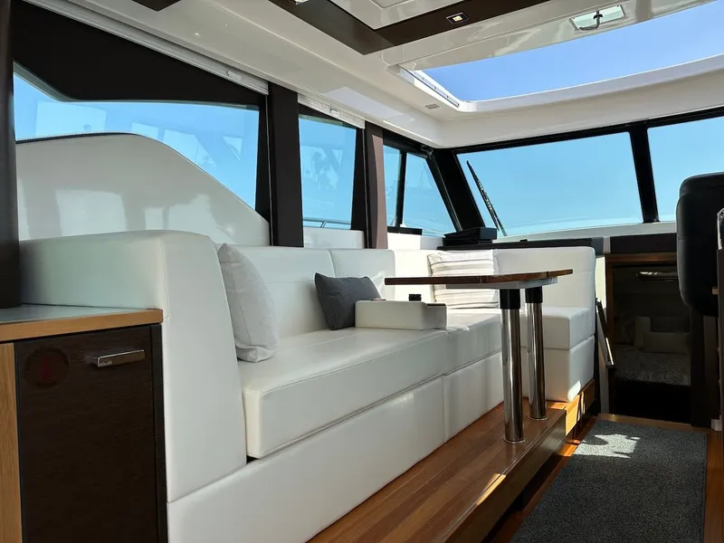 Slide: The Image of Interior of 2019 Tiara Yachts Coupe 39 with luxurious white sofa. - 15