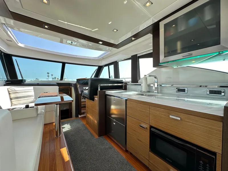 Slide: The Image of Interior of 2019 Tiara Yachts Coupe 39 featuring modern kitchen. - 18