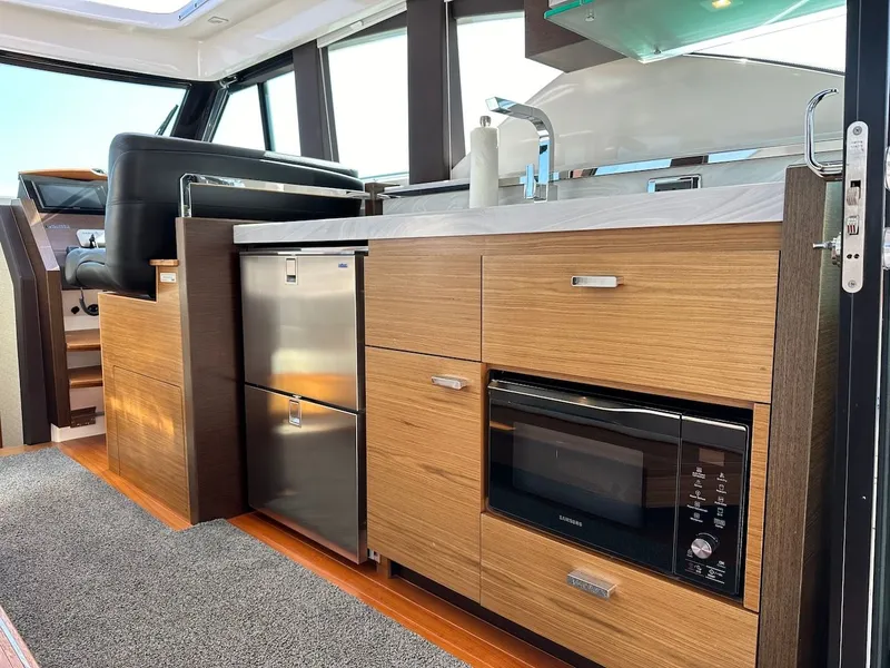 Slide: The Image of Interior of 2019 Tiara Yachts Coupe 39 with modern kitchen. - 20