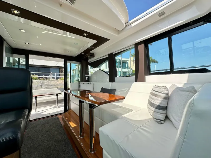 Slide: The Image of Interior of 2019 Tiara Yachts Coupe 39 with luxurious seating area. - 24