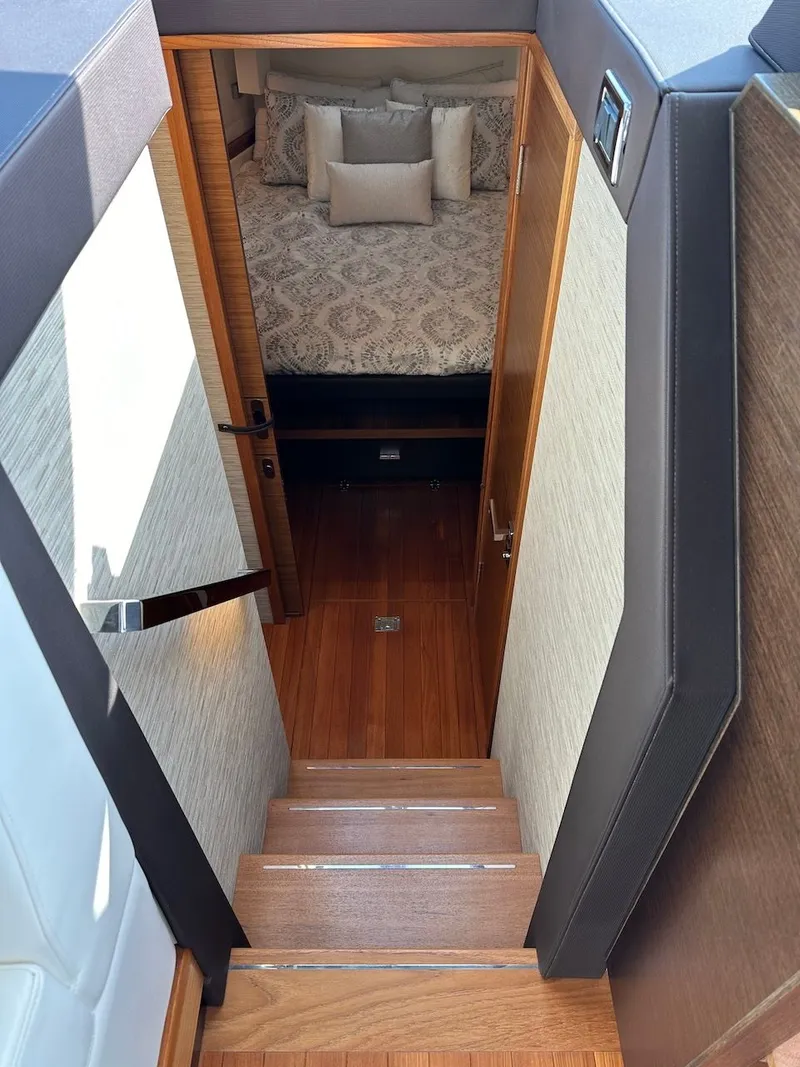 Slide: The Image of Interior of 2019 Tiara Yachts Coupe 39 with stairs and bedroom. - 30