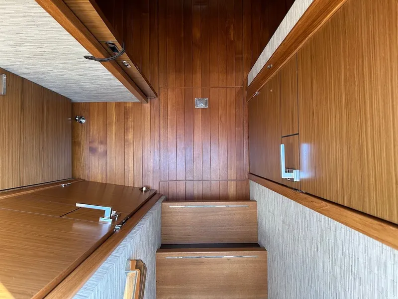 Slide: The Image of Interior of 2019 Tiara Yachts Coupe 39 with wooden paneling. - 31