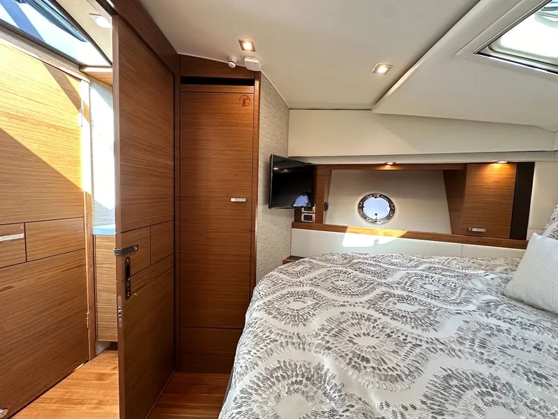Slide: The Image of Interior of 2019 Tiara Yachts Coupe 39 with luxurious bedroom. - 35