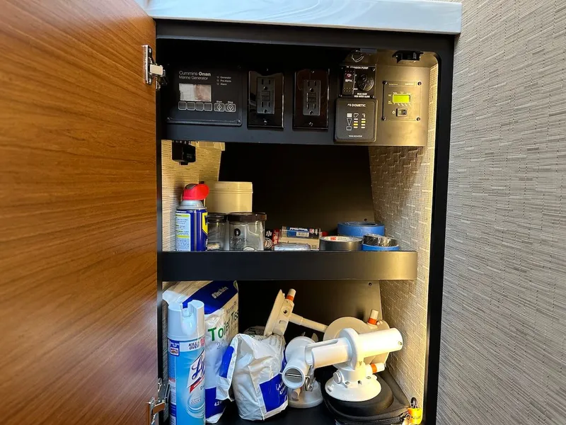 Slide: The Image of Storage cabinet in Tiara Yachts Coupe 39 with cleaning supplies and tools. - 41