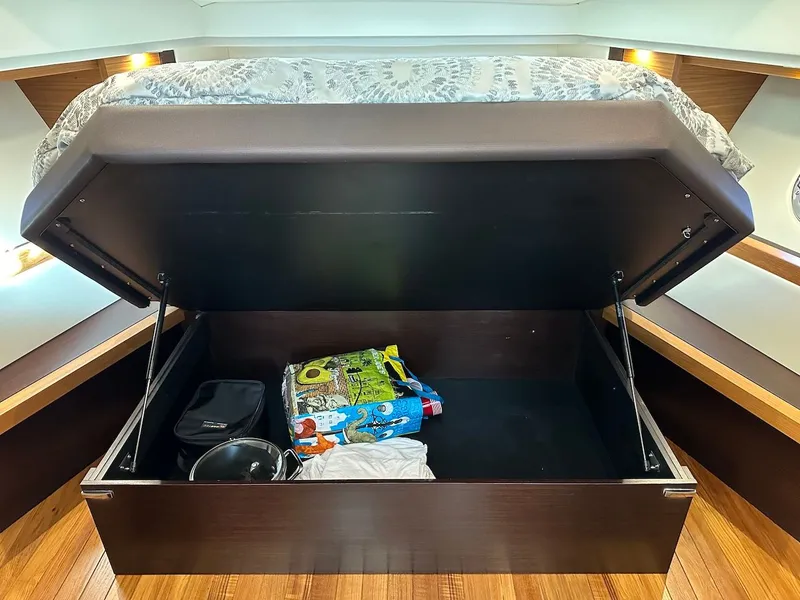 Slide: The Image of Under-bed storage in a 2019 Tiara Yachts Coupe 39. - 44