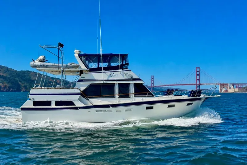 The Image of 1987 PT Sundeck yacht cruising near Golden Gate Bridge on a sunny day. - 0