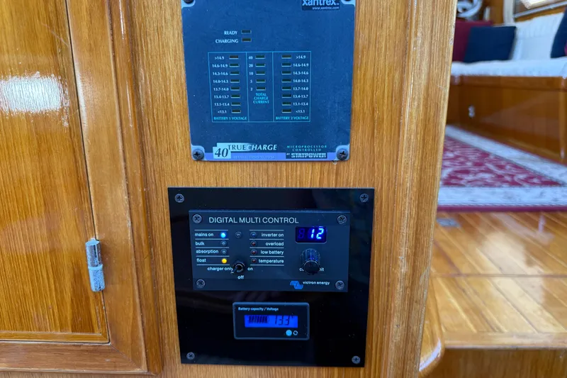 Slide: The Image of Digital control panel on 1987 PT Sundeck boat, featuring battery and charging indicators. - 27