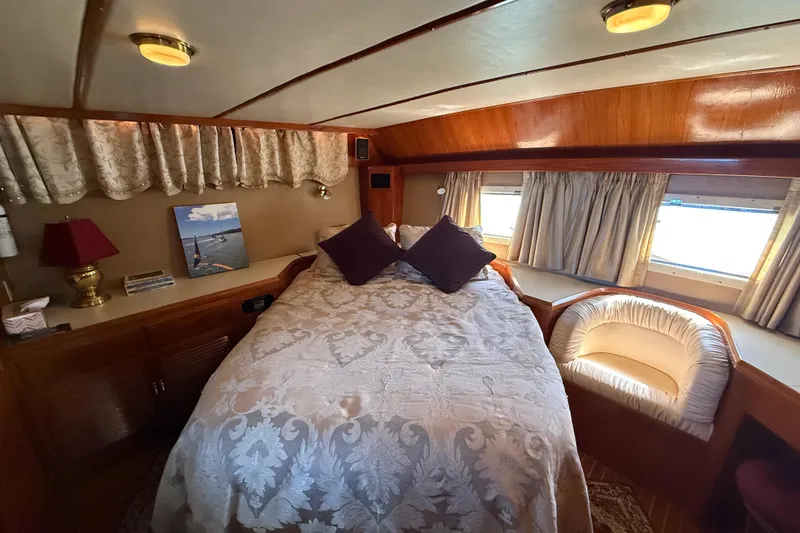 Slide: The Image of Cozy bedroom in 1987 PT Sundeck yacht with elegant decor and natural light. - 30