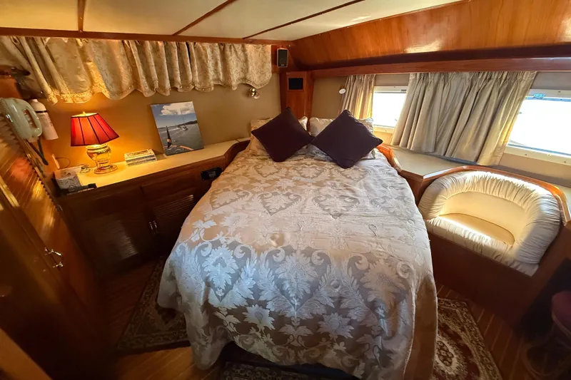 Slide: The Image of Cozy 1987 PT Sundeck yacht bedroom with elegant decor and natural light. - 31