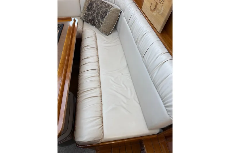 Slide: The Image of Cream leather seating on 1987 PT Sundeck boat with decorative pillow. - 42