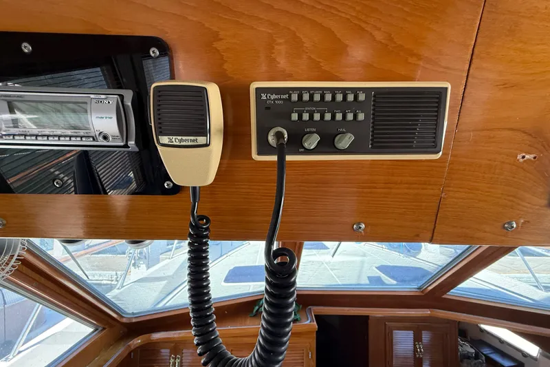 Slide: The Image of 1987 PT Sundeck boat interior with Cybernet radio and Sony marine stereo system. - 55