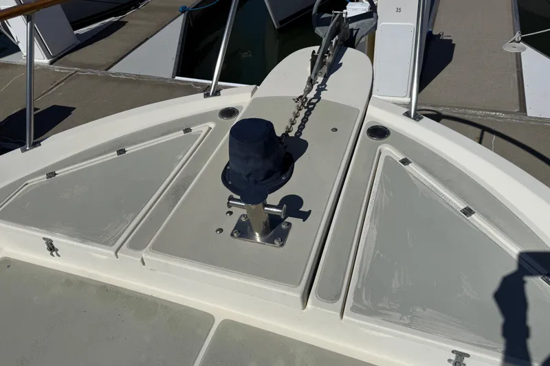Slide: The Image of 1987 PT Sundeck boat deck with anchor chain and fittings. - 58