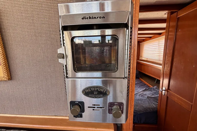 Slide: The Image of Stainless steel heater inside a 1974 Skookum 34 boat cabin. - 28
