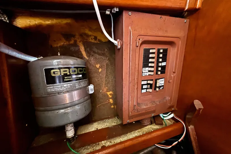Slide: The Image of Electrical panel and Groco pressure tank inside a 1974 Skookum 34 boat. - 42