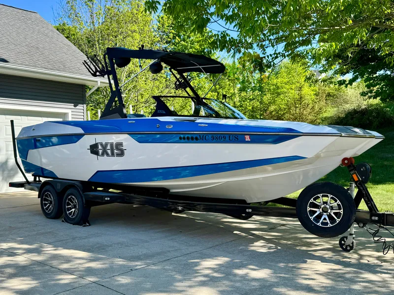The Image of 2022 Axis Wake Research A24 boat on trailer outdoors. - 0