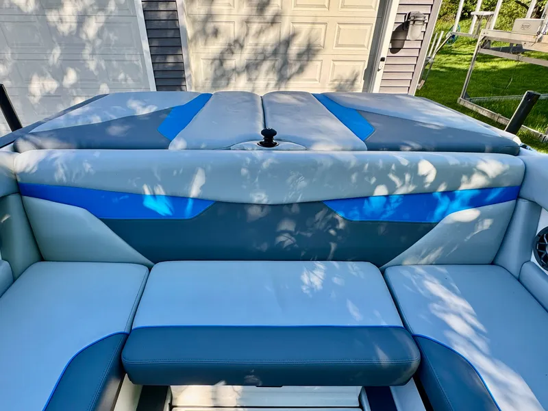 Slide: The Image of 2022 Axis Wake Research A24 boat interior with blue accents. - 24