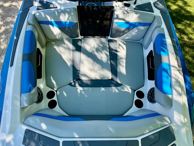 Slide: The Image of Interior of 2022 Axis Wake Research A24 boat with blue and gray seating. - 26