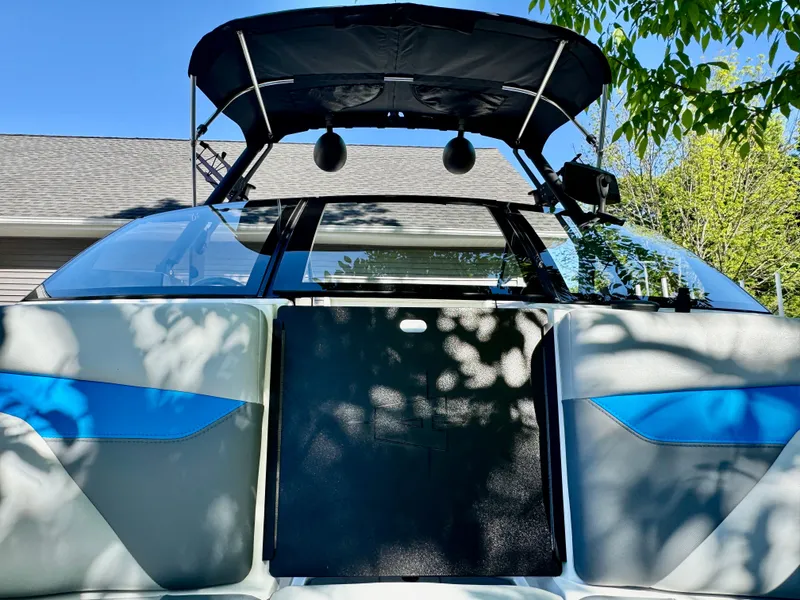 Slide: The Image of 2022 Axis Wake Research A24 boat with sunshade and speakers. - 28