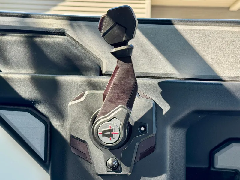 Slide: The Image of Close-up of a control lever on a 2022 Axis Wake Research A24 boat. - 39