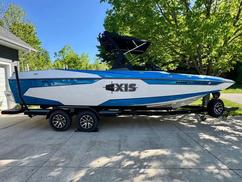Slide: The Image of 2022 Axis Wake Research A24 boat on trailer outdoors. - 4